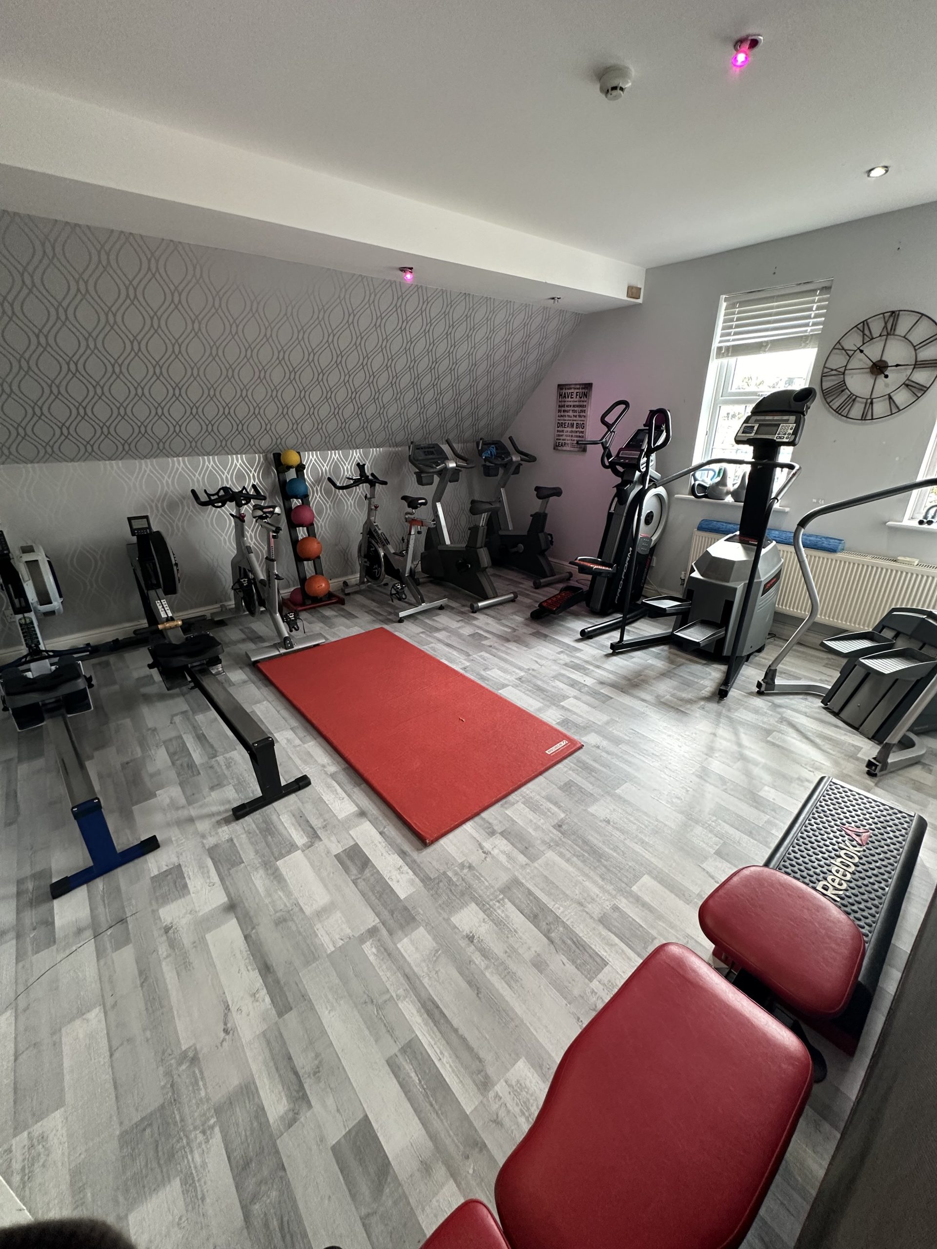 Bikes, cross trainers and rowers in the cardio room