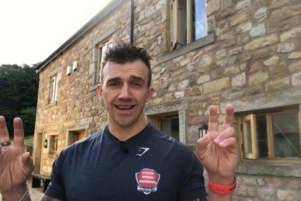 A Masters Fitness trainer talking to camera outside