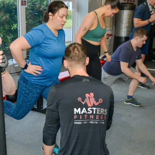 A Masters Fitness coach leading a group session