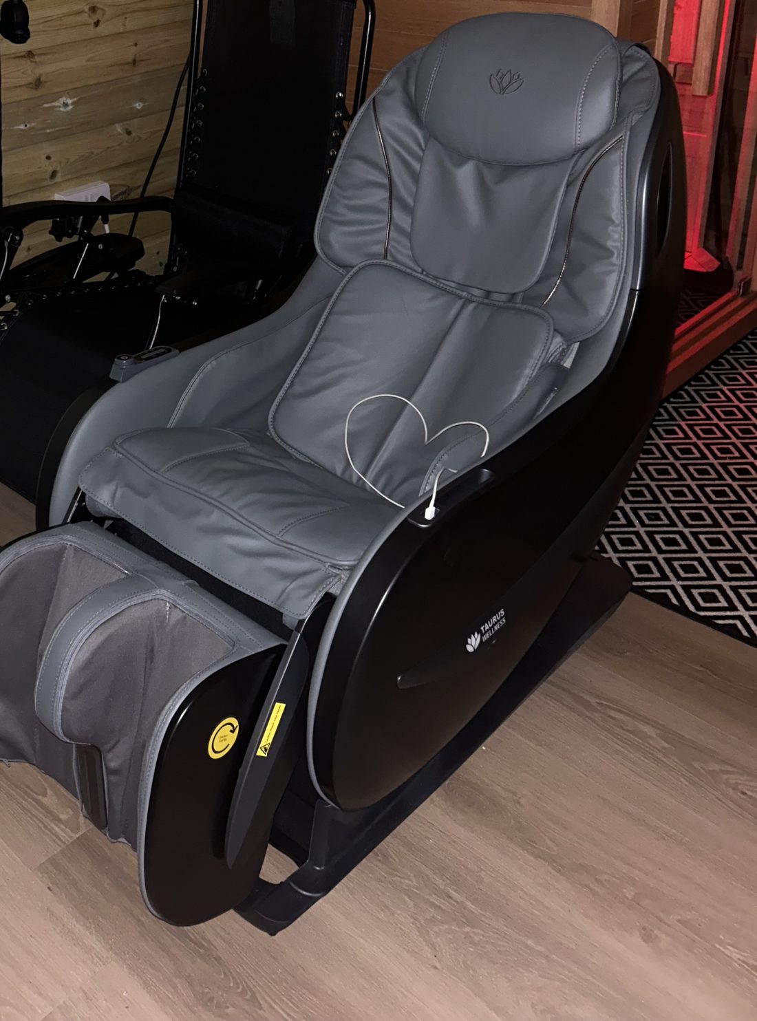 The grey massage chair in the Recovery Zone